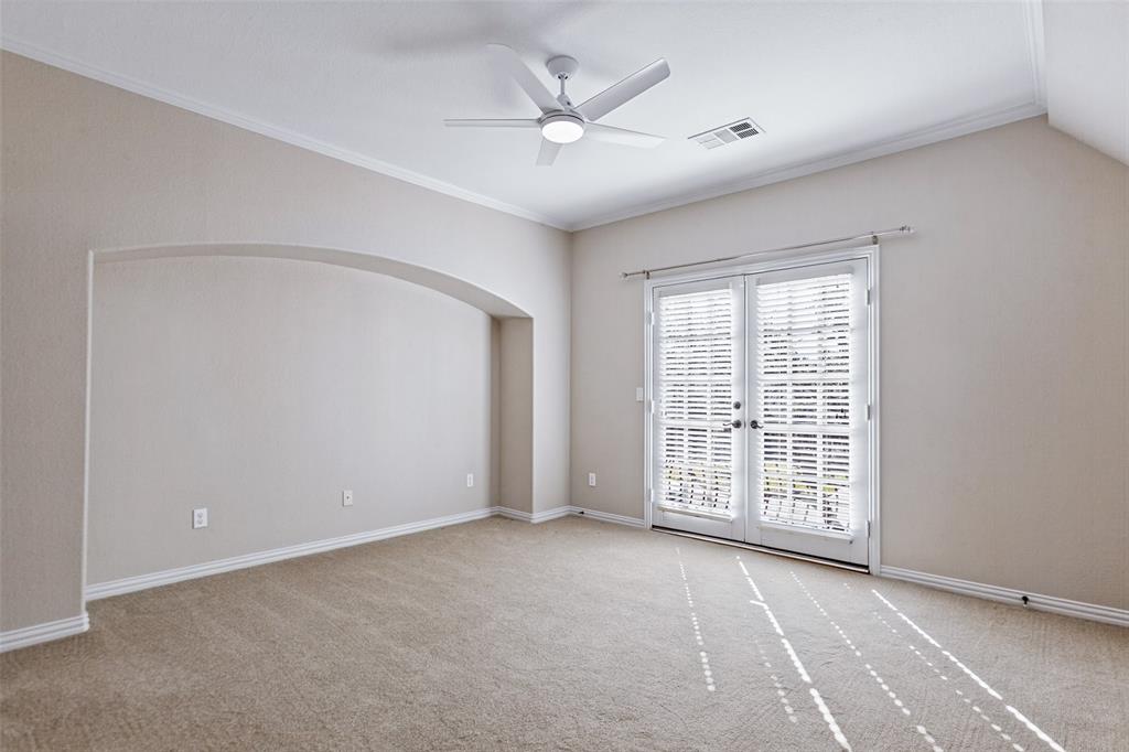 Upstairs bedroom with French doors to Juliette balcony.  All bedrooms are ensuite and have walk-in closets