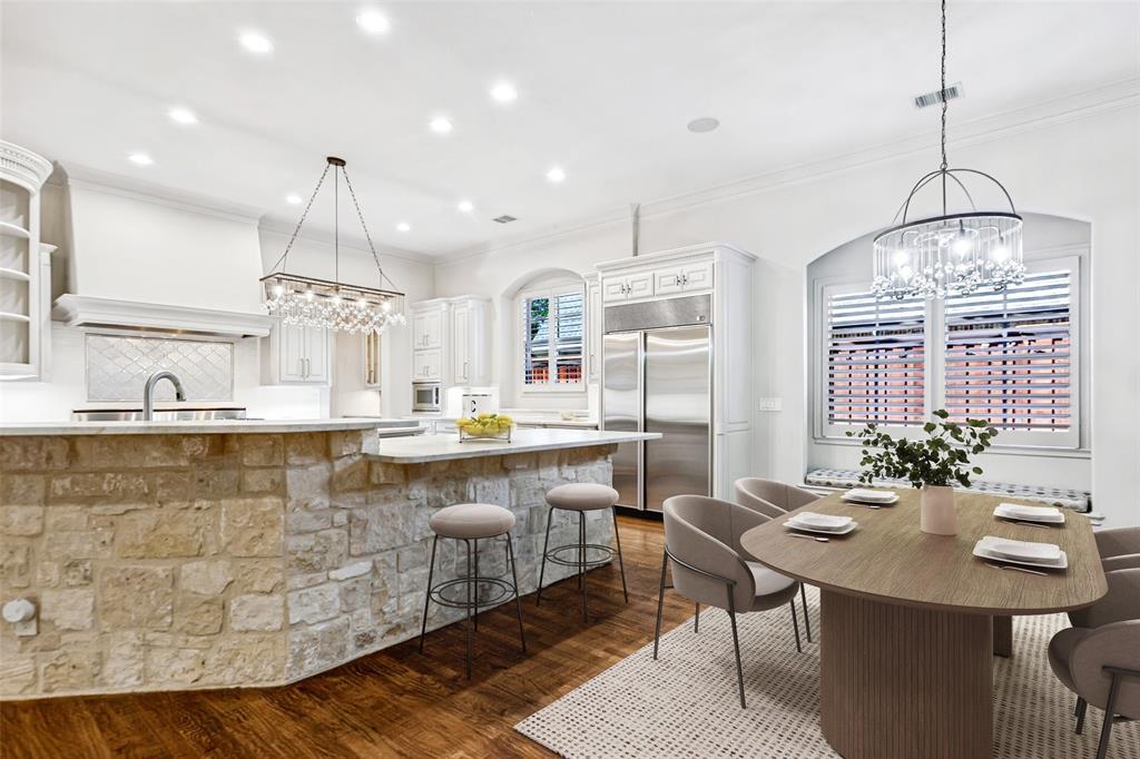 Wonderfully spacious and bright Kitchen offers a breakfast bar and adjacent Breakfast Room with window seat.
