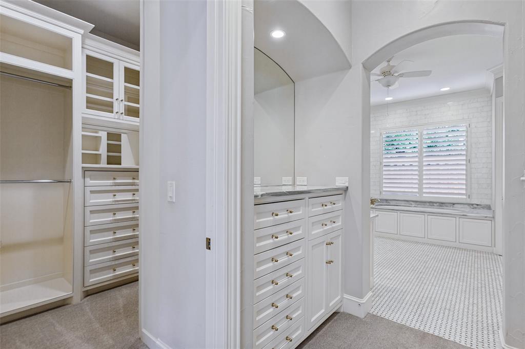 Custom and beautifully designed storage + view of "his" closet.