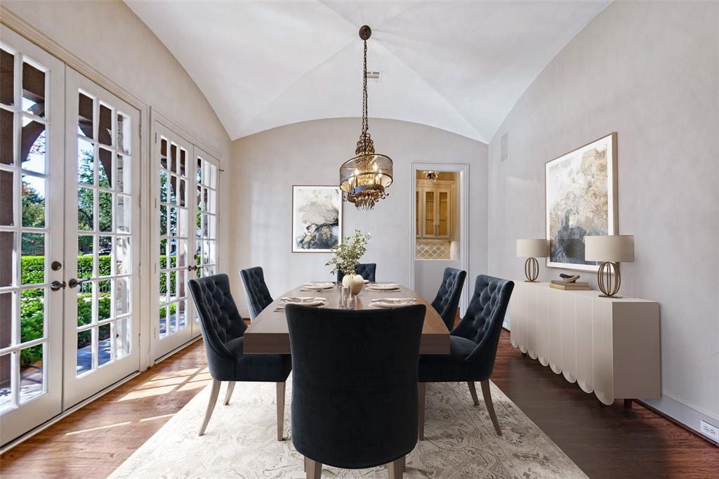 Virtually staged Dining Room enjoys abundant natural light and a groin vaulted ceiling. Butler's Pantry is beyond.