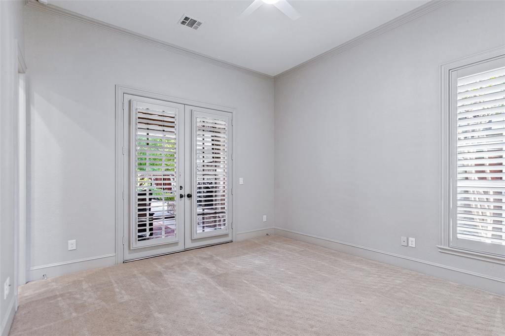 An additional downstairs bedroom and bath is on the other side of the house. French doors lead to the outdoor living area.