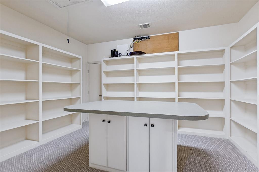 The Craft Room offers endless storage and a task iron for gift wrapping or projects!