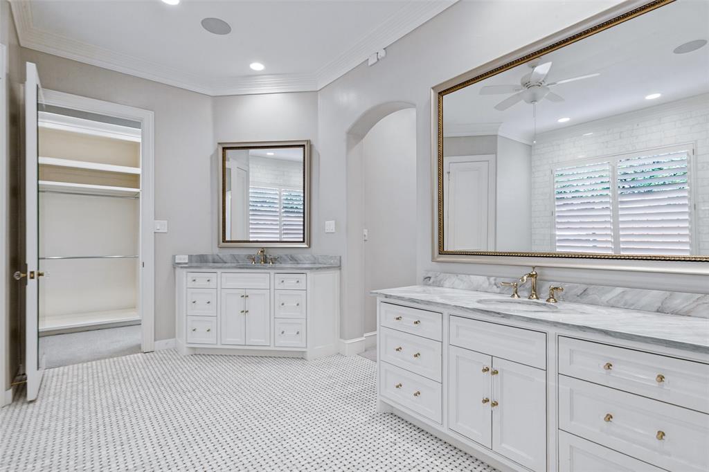 View of both vanities and entrance to "her" closet.