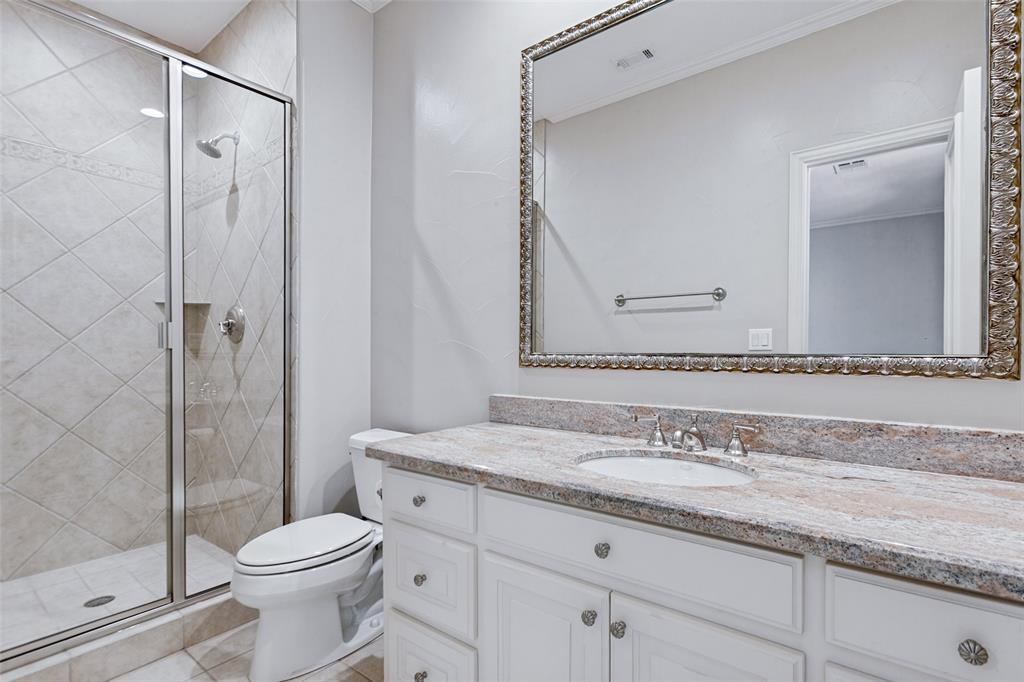 An example of a private bath with one of the bedrooms.  Stunning marble and framed mirror.