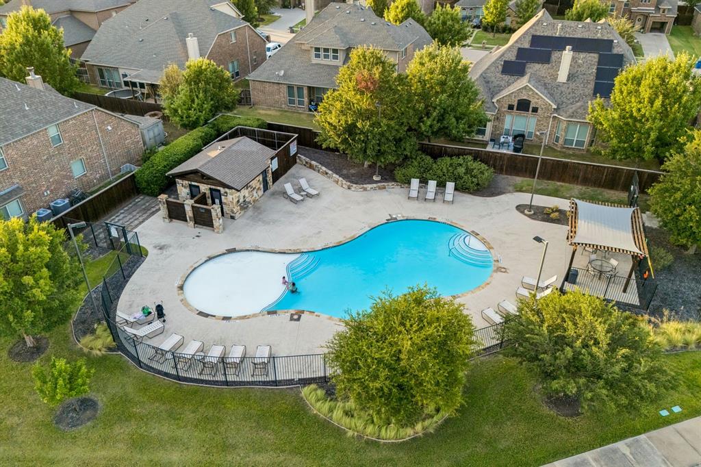Community amenities include a neighborhood swimming pool for residents to enjoy.