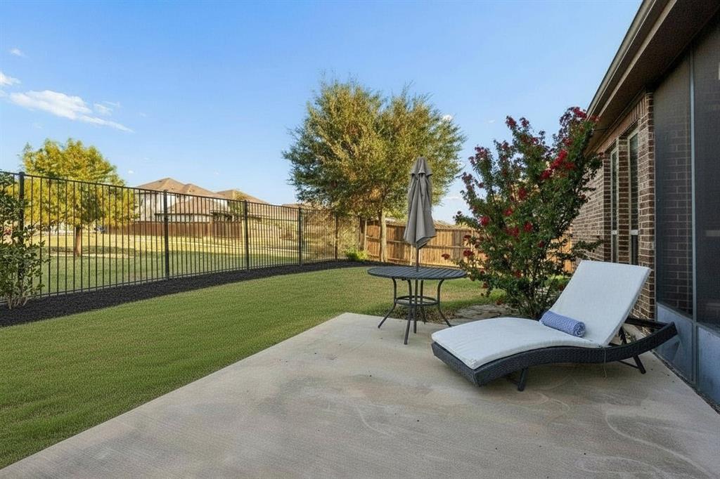 Enjoy an open greenbelt view, wrought iron rear fencing and extended patio space for outdoor living and entertaining.