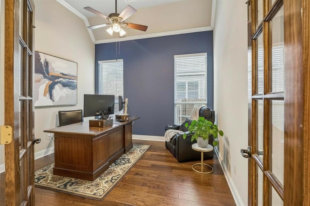 Dedicated first-floor home office provides a separate workspace without sacrificing one of the home's four bedrooms.