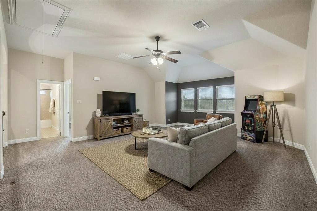 Large upstairs game room creates a second living area with plenty of flexibility for recreation, media or entertaining.