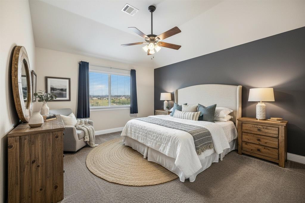 Upstairs fourth bedroom pairs with a nearby full bath and game room, creating a flexible second-floor retreat.