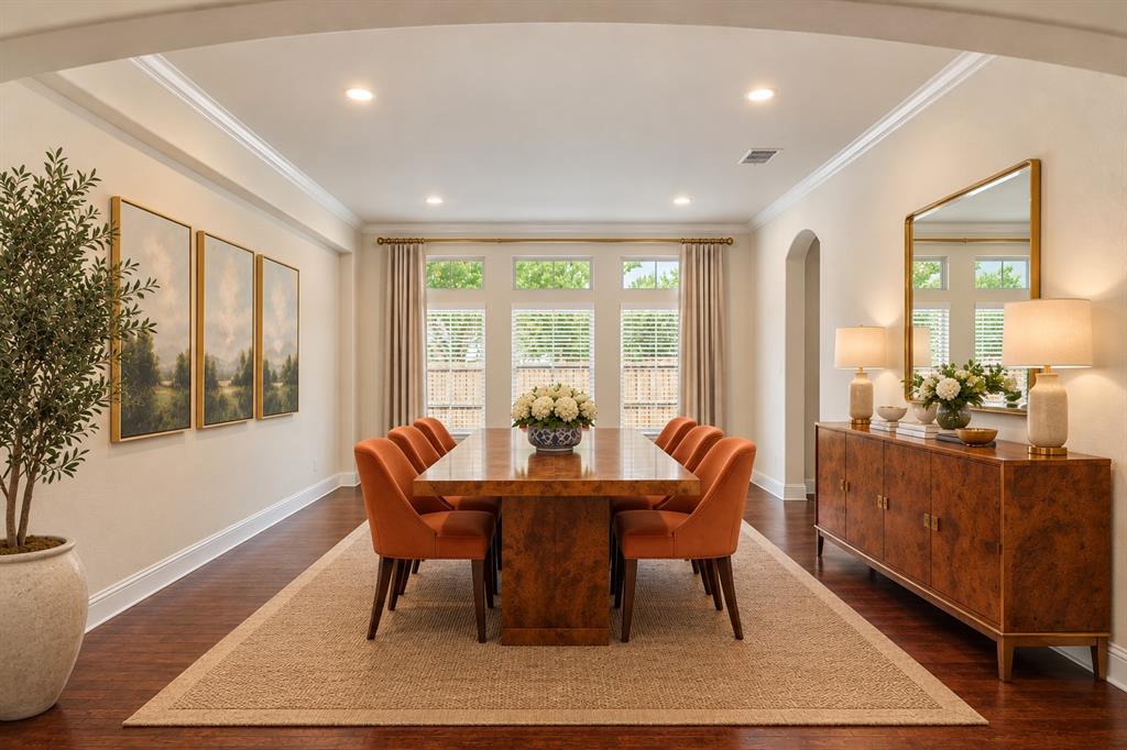 Secondary flexible room virtually staged as a formal dining room