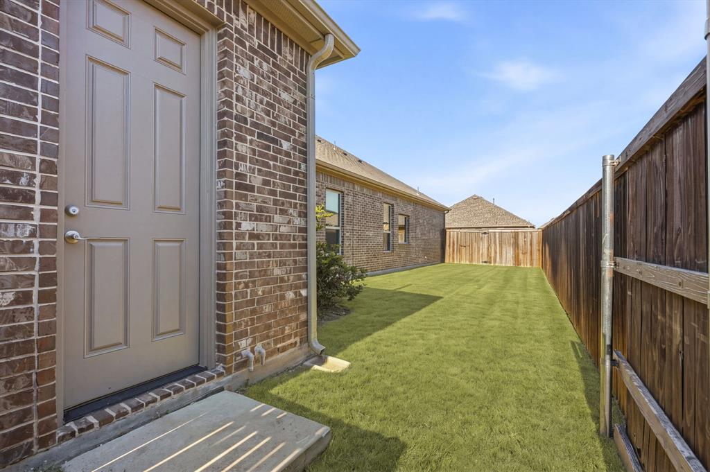 garage exit door to back and side yard