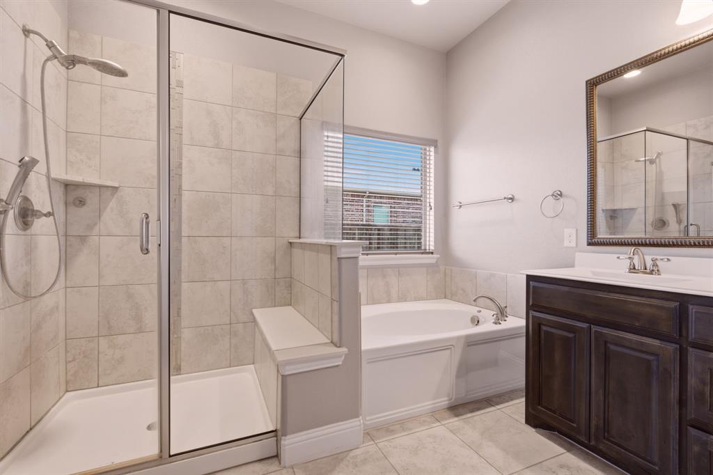 glass shower and soaking tub