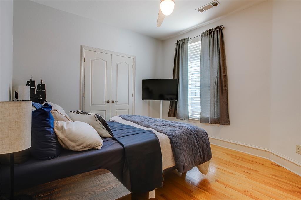 Hardwood flooring, crown molding, and baseboard trim throughout