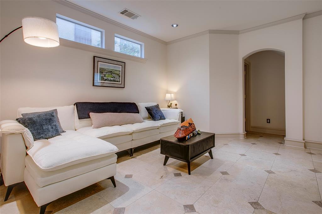 Spacious room featuring light-toned tile flooring with diamond accents