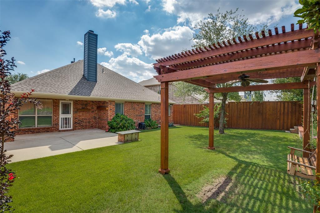 View of yard featuring a patio, a fenced backyard, and a pergola