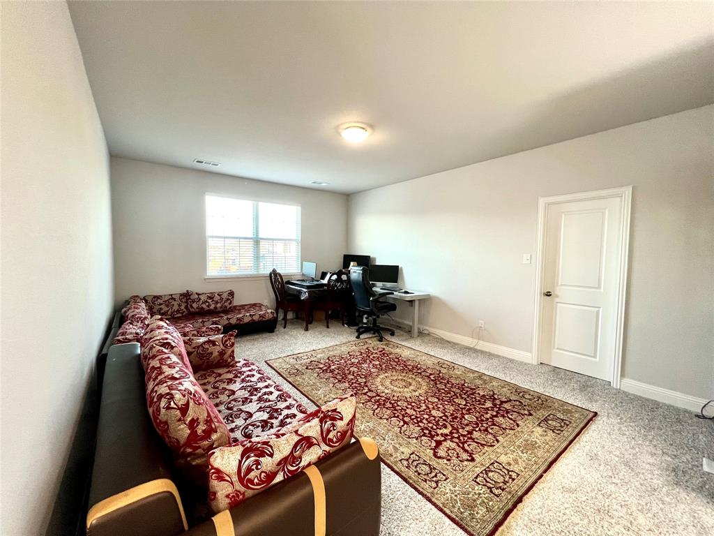 Home office featuring carpet flooring