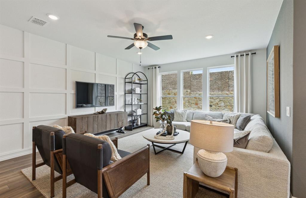 *Model Representation - Spacious gathering room with large windows