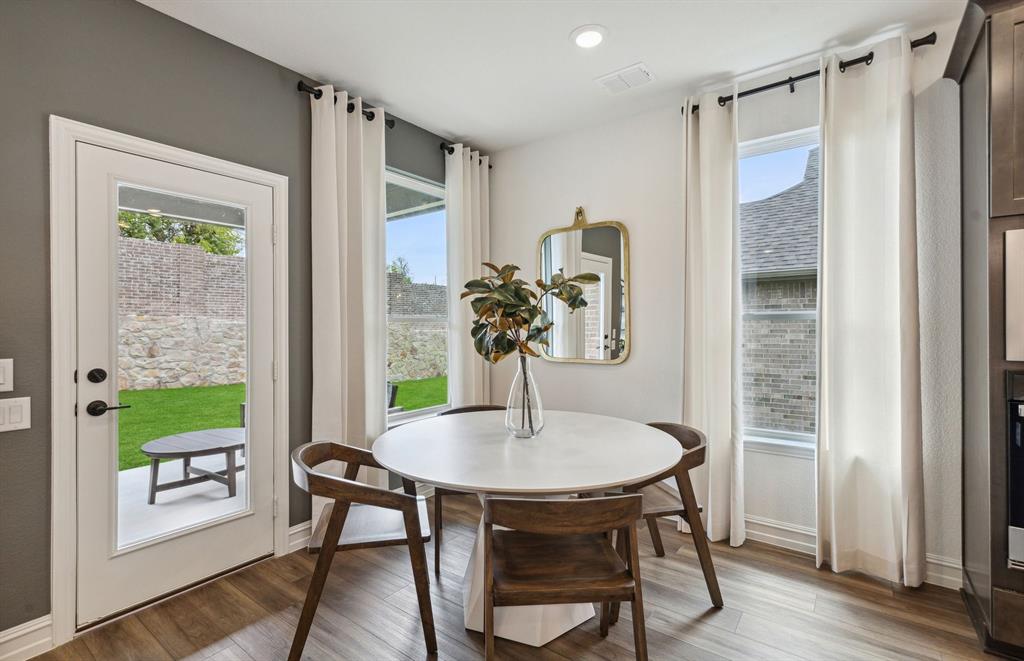 *Model Representation - Dining area off kitchen with large windows