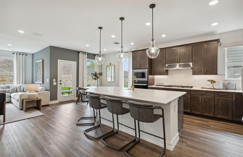 *Model Representation - Large island gathering room and dining areas overlooking
