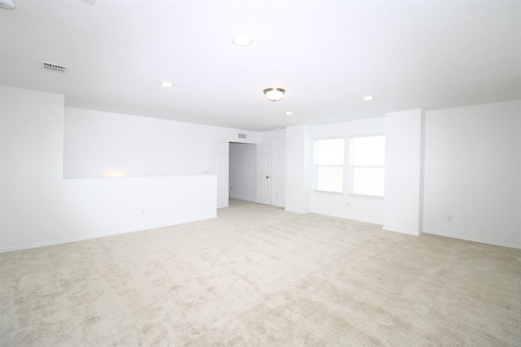 Spacious interior featuring wall-to-wall carpeting, recessed lighting, neutral wall finishes, and double-pane windows