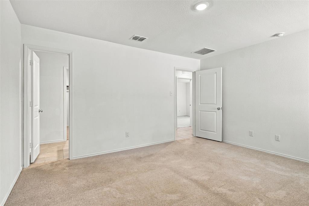 Primary bedroom as viewed from far corner.