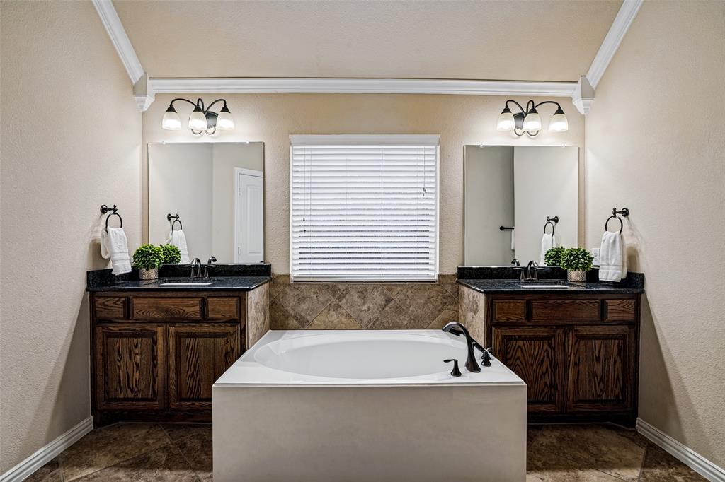 Dual vanities, large soaking tub, dual closets and separate walk in shower. Linen closet
