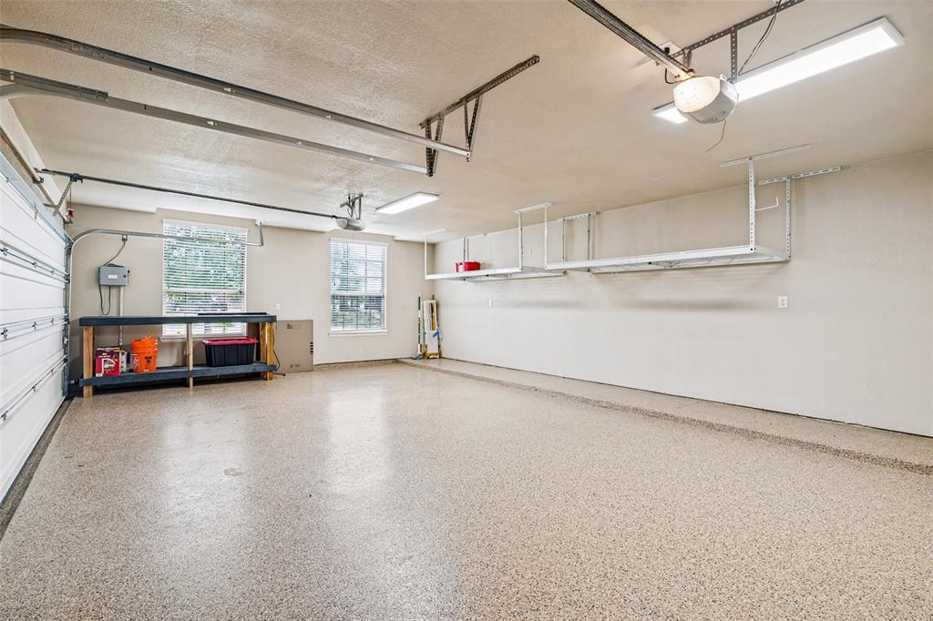 3 Car Garage with Expoxy Flooring and extra storage racks