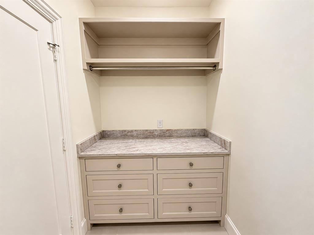 Laundry folding area with tons of storage.