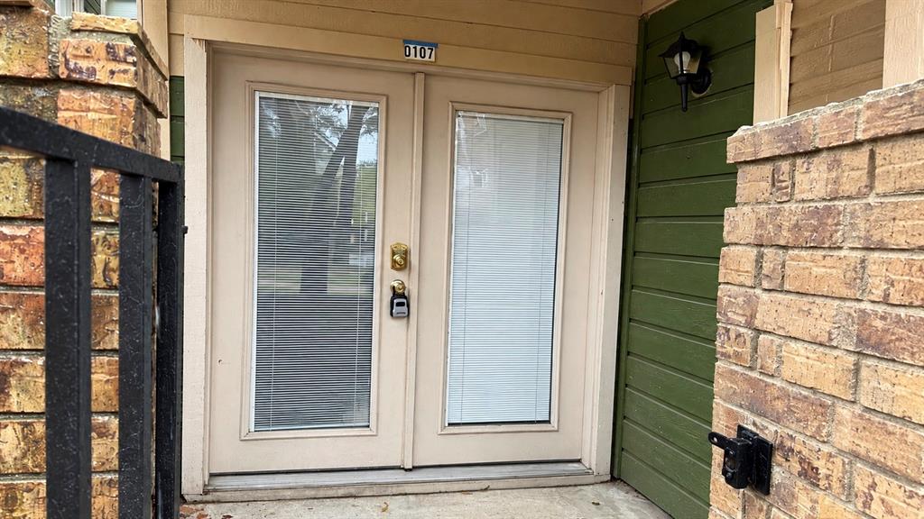 Gated covered front Patio with storage closet