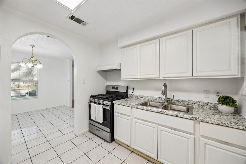 Light and bright white kitchen open to dining area. Light and bright white kitchen open to dining area.