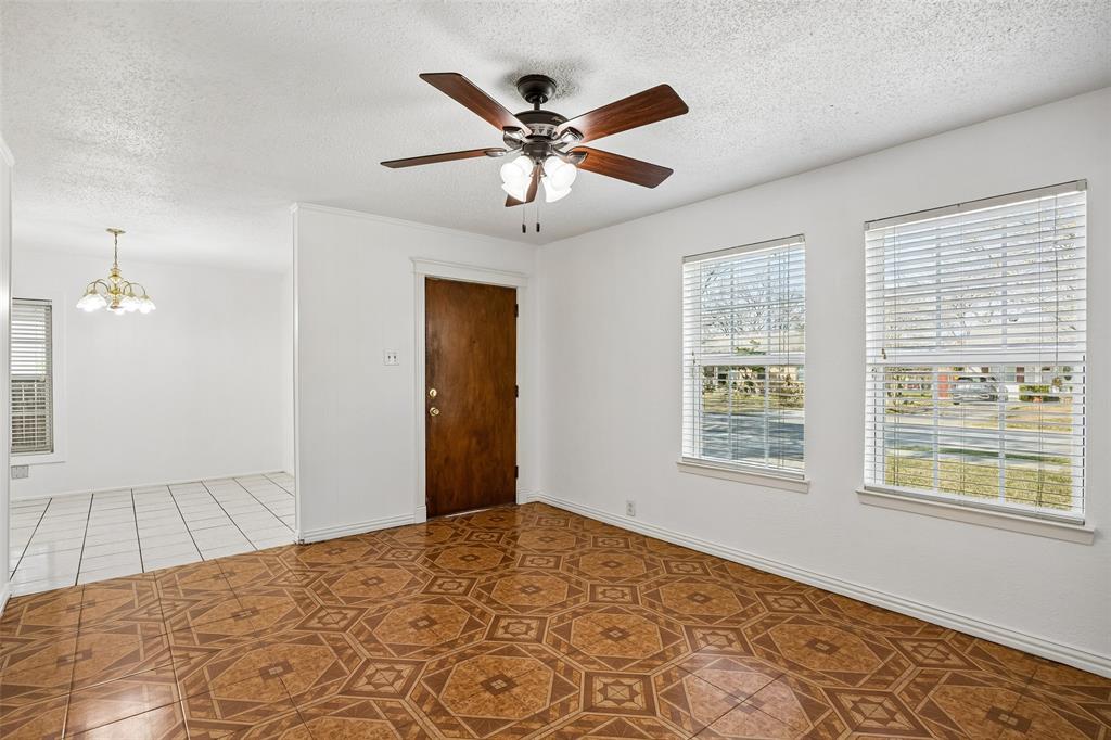 Open living room with views of front yard and open to the dining area. Open living room with views of front yard and open to the dining area.