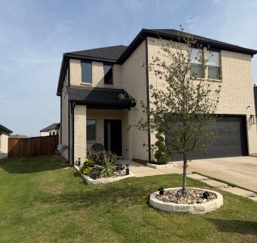 Two-story brick exterior featuring a dark shingle roof, attached garage, stone-lined landscaping beds, and a paved walkway Two-story brick exterior featuring a dark shingle roof, attached garage, stone-lined landscaping beds, and a paved walkway