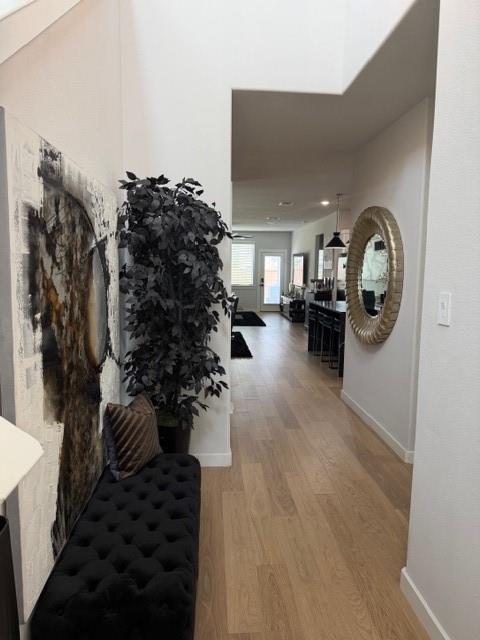 Entryway featuring high ceilings, light-toned wood-finish flooring, and recessed lighting Entryway featuring high ceilings, light-toned wood-finish flooring, and recessed lighting