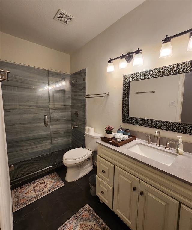 Nicely Appointed Second Bathroom. Quartz Top and Tiled Shower