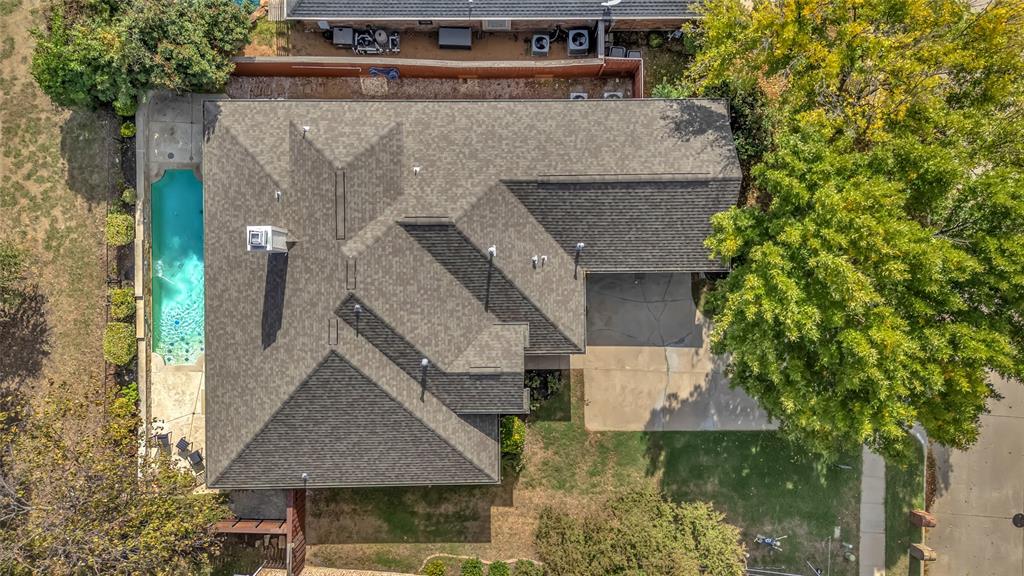 Aerial view of the home, pool, 2-car garage, and driveway — 5804 Lafayette Dr, Frisco