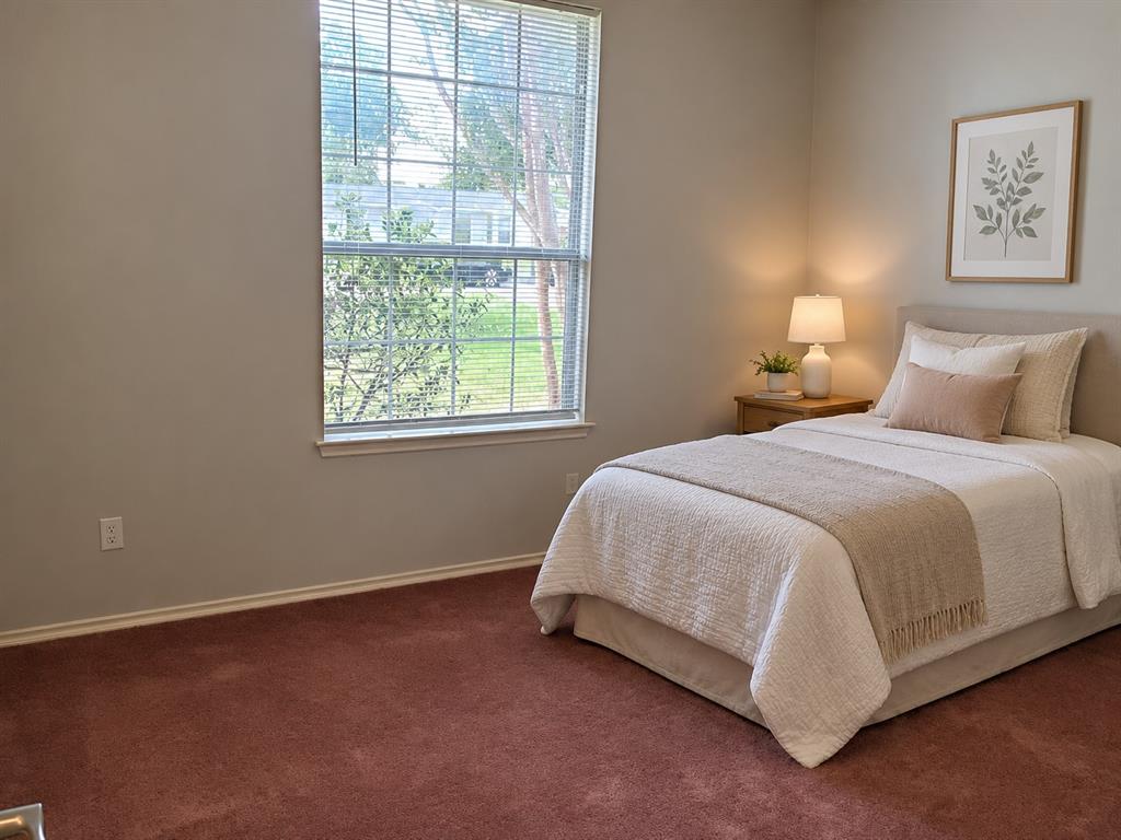 Neutral-toned walls paired with textured carpeting and a large single-hung window Neutral-toned walls paired with textured carpeting and a large single-hung window