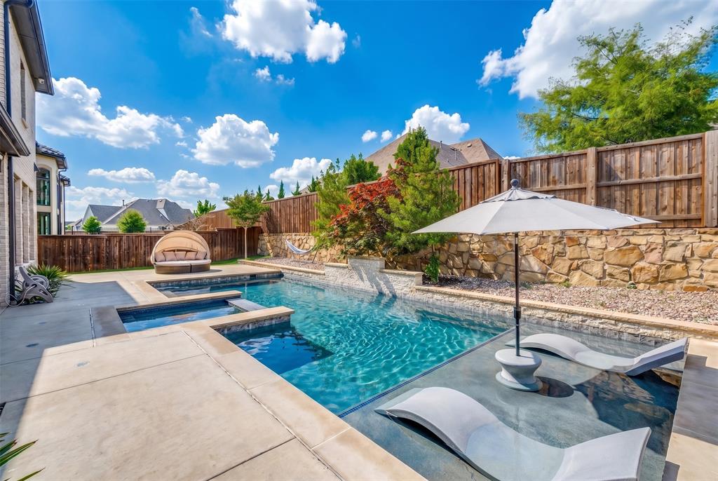 Private backyard retreat. Relax in the spa or heated pool with tanning ledge and upgraded LED lighting.