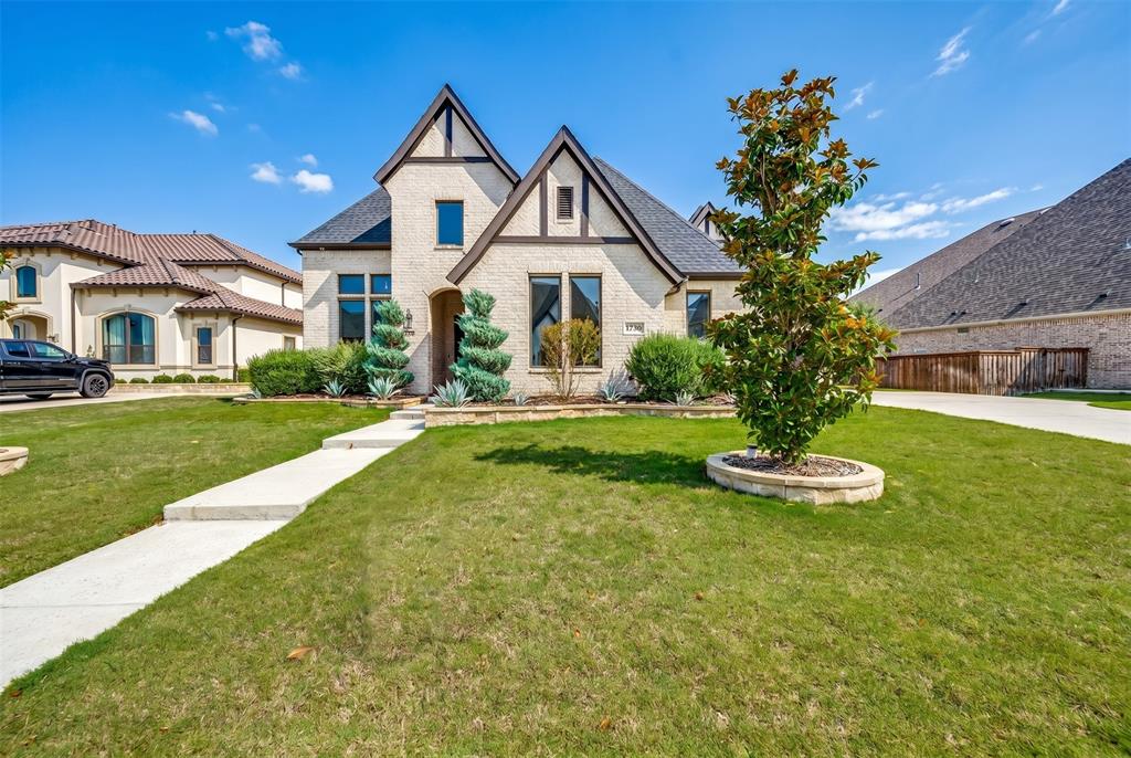 Stucco exterior featuring dark trim accents and multiple gables Stucco exterior featuring dark trim accents and multiple gables
