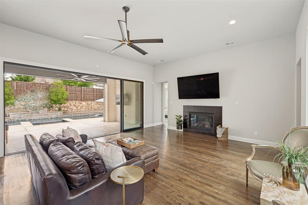 Glass sliding wall allows you to enjoy both spaces at once. There are 3 entry points to the patio creating great flow in the home.