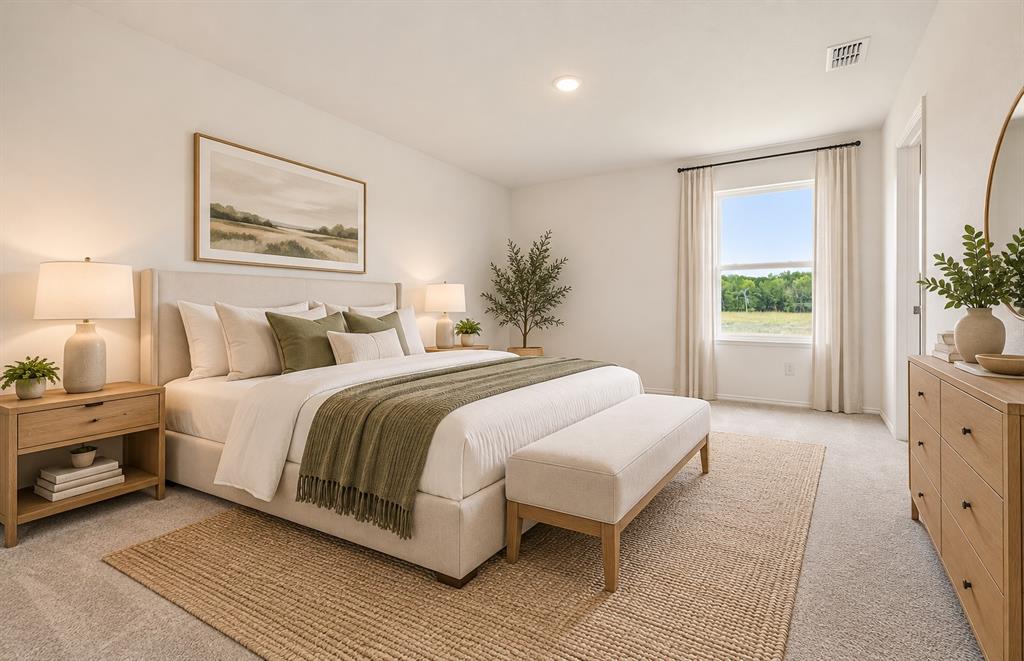 Spacious room featuring neutral carpeting, recessed ceiling lighting, and a window with natural light