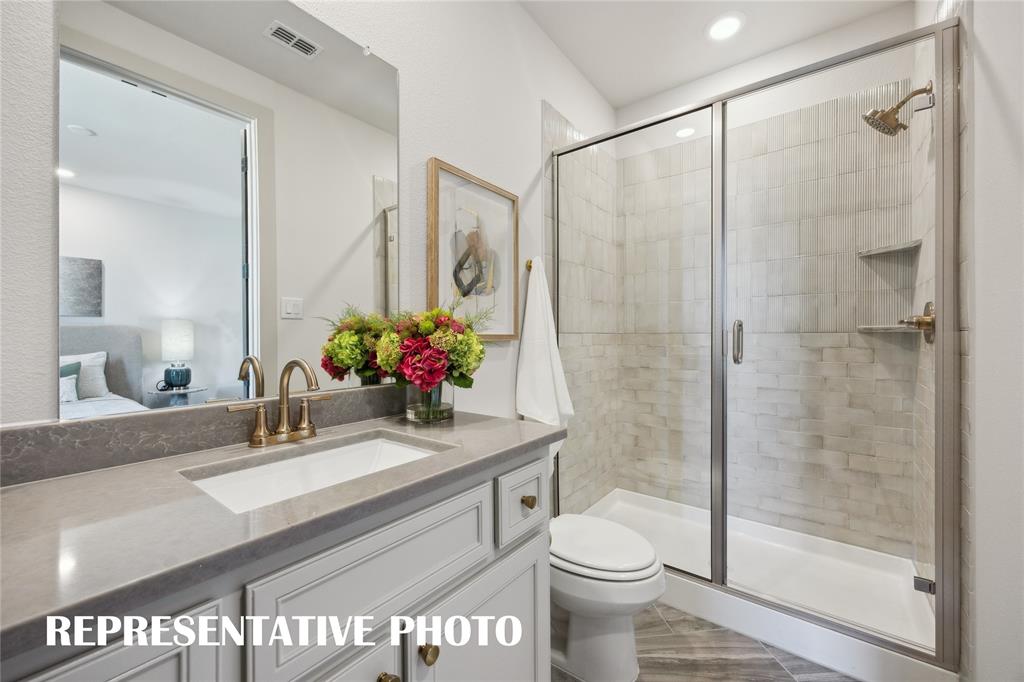 Your guests will never want to leave the beautiful and spacious guest baths in our Sophie plan!  REPRESENTATIVE PHOTO