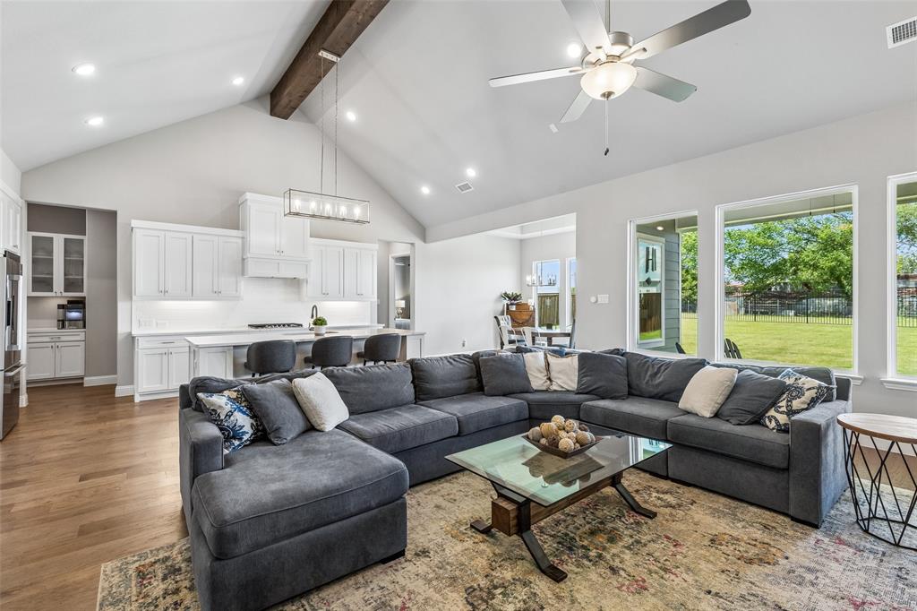 Open living space and abundance of natural light from that wall of windows