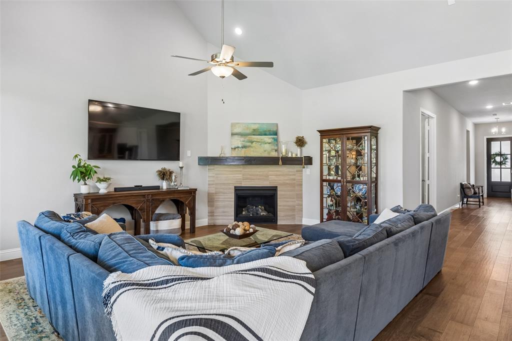 Fireplace, grand entry and custom front door adding to the natural light