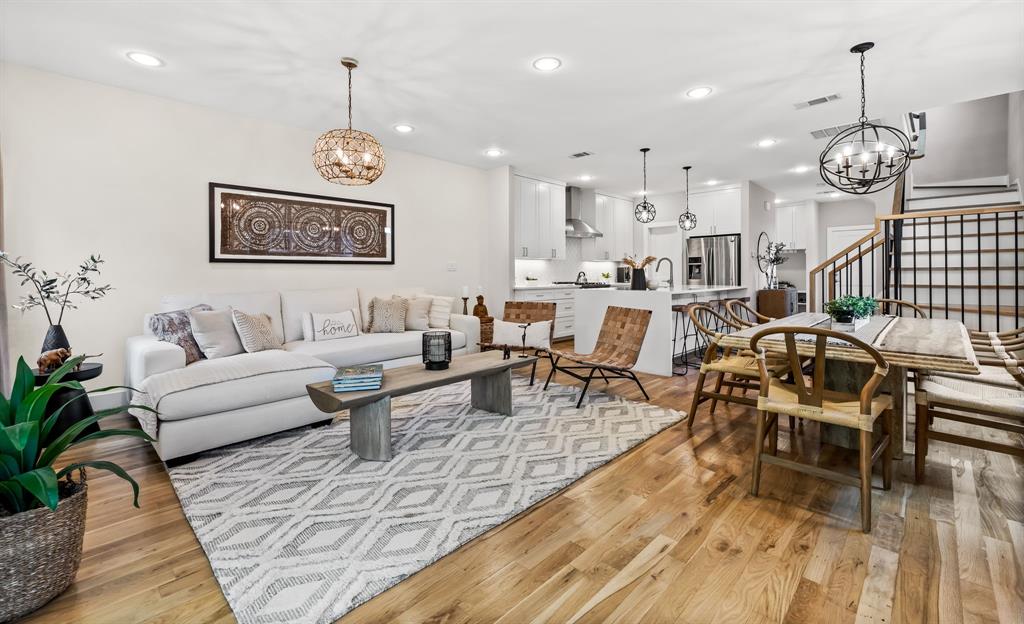 Living room featuring an inviting chandelier, and light hardwood / wood-style floors