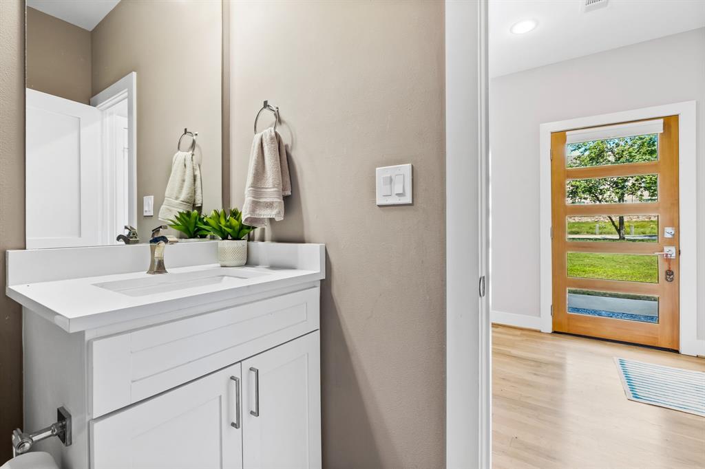Bathroom with wood-type flooring and vanity
