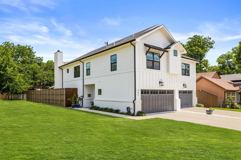 View of front facade with a garage and a front yard