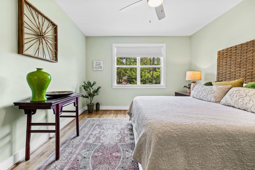 Bedroom with wood-type flooring and ceiling fan