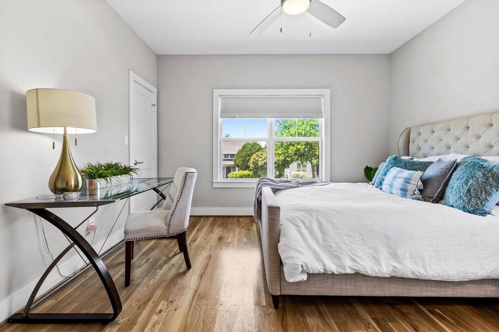 Bedroom featuring hardwood / wood-style floors and ceiling fan