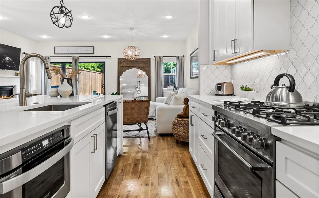 Island features pull out microwave drawer dishwasher and pull out trash drawer.
