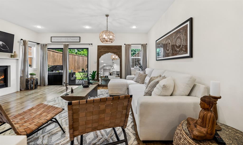 Living room featuring a chandelier and wood-type flooring